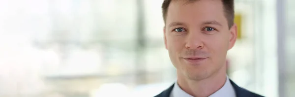 stock image Portrait of young handsome businessman in suit in office. Business staff concept