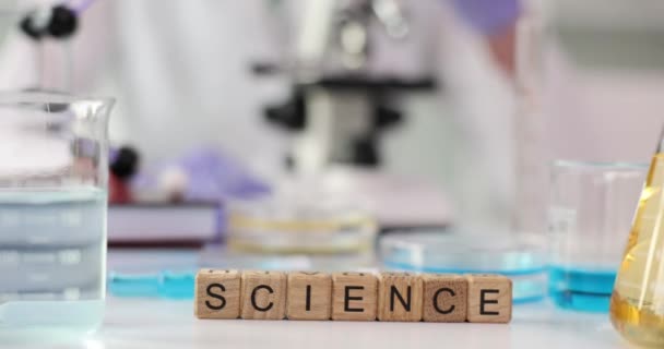 Word Science Collected Wooden Cubes Laboratory Table Microscope Laboratory Glassware — Stock Video