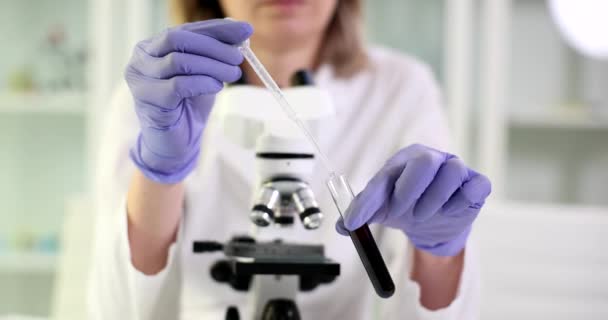 Scientist Drips Liquid Test Tube Black Liquid Oil Checking Quality — Stock Video