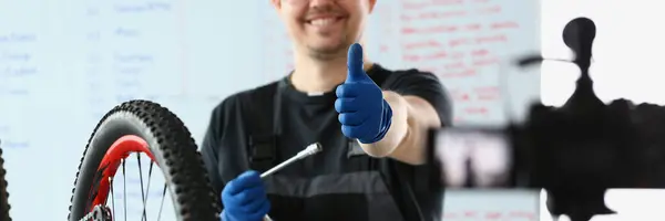Male Blogger Holds Thumbs Repairs Bicycle Remotely Bike Maintenance Live — Stock Photo, Image