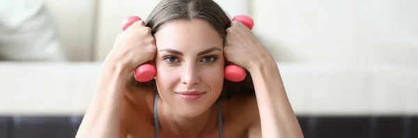 Beautiful Smiling Woman Lies Holds Dumbbells Closeup Home Fitness Workout — Stok fotoğraf