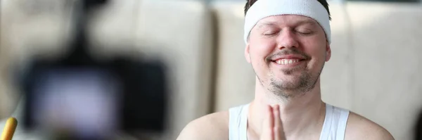 Calm Young Male Blogger Clasps Hands Namaste Gesture Peaceful Look — kuvapankkivalokuva