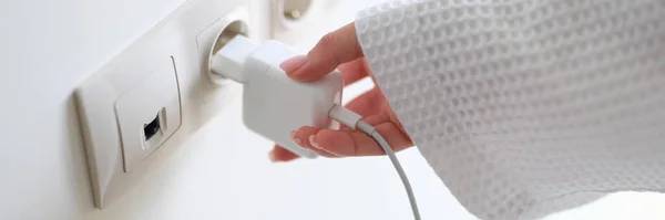 Woman White Bathrobe Inserting Plug Outlet Home Hand Closeup Energy — Stock Photo, Image