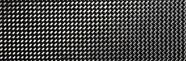 灰色の粒状炭素繊維の背景マクロを閉じます 耐久性のある素材コンセプト — ストック写真