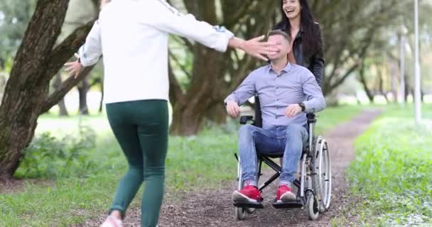 Young Woman Hugs Happy Man Wheelchair Walk Park Movie Friends — Stock Video