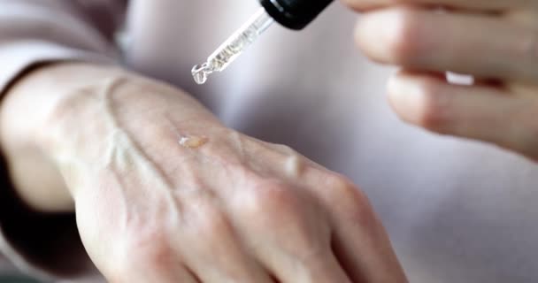 Woman Dripping Moisturizing Oil Skin Hands Closeup Movie Slow Motion — Vídeo de stock
