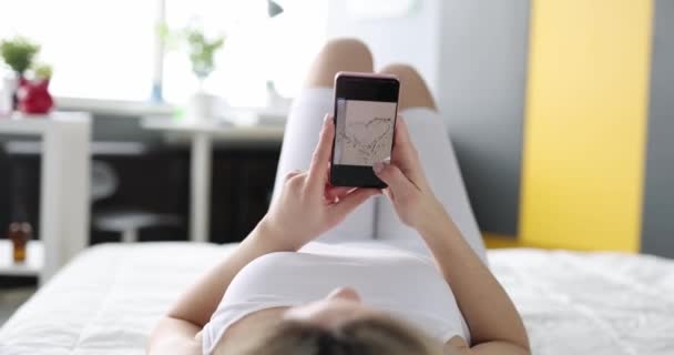 Woman Lying Sofa Flips Photo Smartphone Screen Close Personal Photos — Stok video