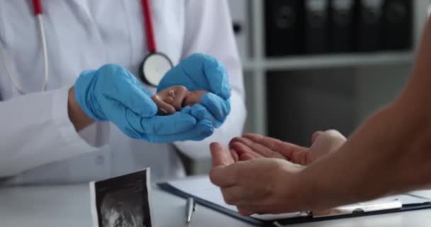 Doctor Holds Model Embryo His Palms Close Preservation Pregnancy Abortion — Αρχείο Βίντεο