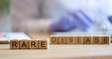 Cubes on the table inscription rare diseases, close-up. Epidemics and pandemics, disaster in medicine