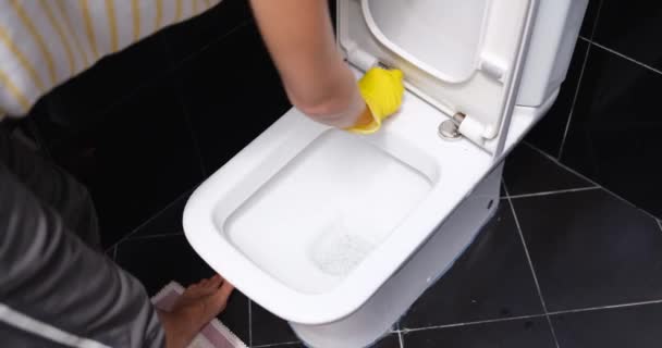 Woman Yellow Gloves Washes White Toilet Bowl Rag Close Toilet — стоковое видео