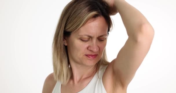 Young Woman White Shirt Stands Light Background Sniffing Armpit Lady — Stock Video