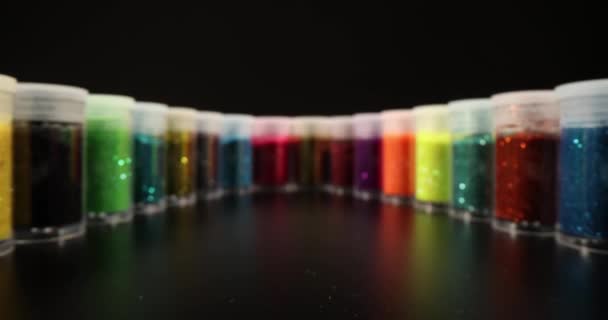 Sealed Jars Multi Colored Shiny Glitter Stand Circle Dark Studio — Stockvideo