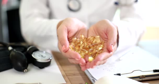 Doctor Holding Gorse Gelatin Capsules Omega Fatty Acids Closeup Movie — Stock Video