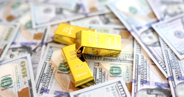 Gold Bars Lying Set Dollar Bills Closeup Movie Slow Motion — Vídeo de stock