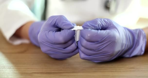 Doctor Gynecologist Gloves Opening Antiinflammatory Suppository Closeup Movie Slow Motion — 图库视频影像