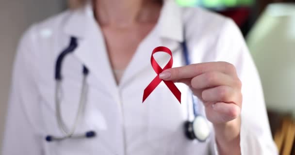 Doctor Holding Red Ribbon Symbol Fight Hiv Closeup Movie Slow — Stock video