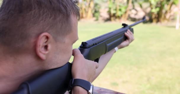 Young Man Shoots Rifle Street Shooting Range Men Entertainment Concept — Stockvideo