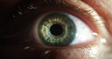Closeup of green female eye with contact lens 4k movie. Vision correction concept