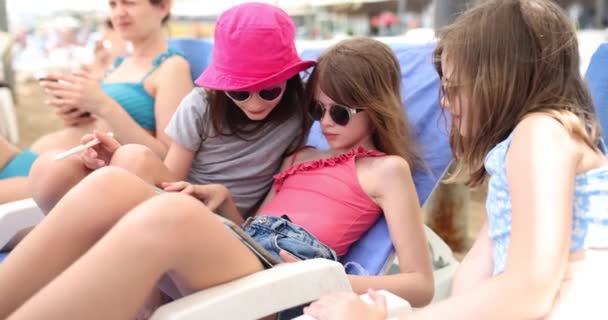 Schoolgirls Lie Sun Loungers Looking Tablet Screen Daytime Concept Technology — Stock Video