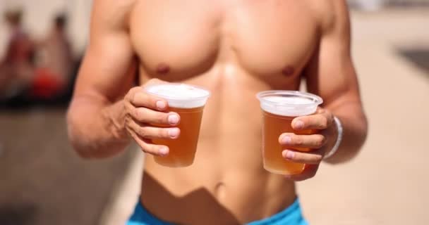 Sporty Man Beach Carries Two Glasses Beer Cold Beer Beach — Stockvideo