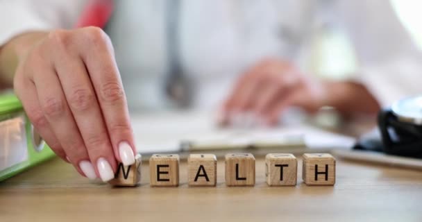 Wooden Blocks Word Health Wealth Doctor Hand Concept Choosing Priority — Stok video