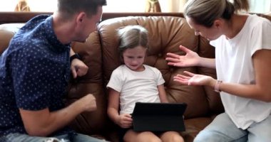 Stop playing parents persuade and scold child daughter for tablet. Children addiction to gadgets and quarrels with children