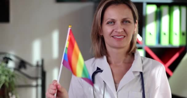 Smiling Female Doctor Showing Support Lgbtq Rainbow Colored Flag Medicine — Stock Video