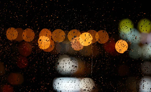 Fondo Borroso Noche Gotas Lluvia Ciudad Sobre Vidrio —  Fotos de Stock
