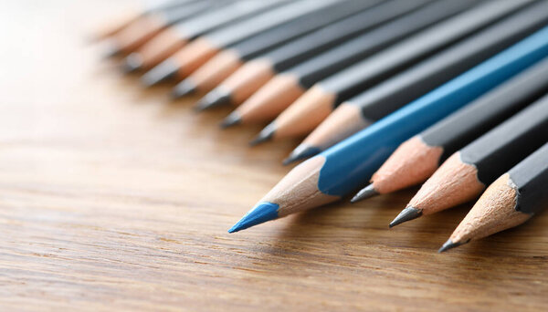 Blue pencil spy between black pencils. Sexual minorities in society concept