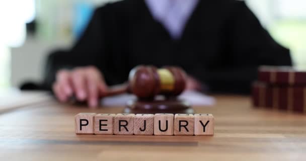 Word Perjury Made Wooden Blocks Judge Knocking Wooden Gavel Intentional — Stock Video