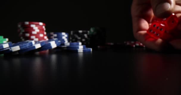 Man Throws Red Transparent Dices Dark Club Premise Casino Chips — Stock Video