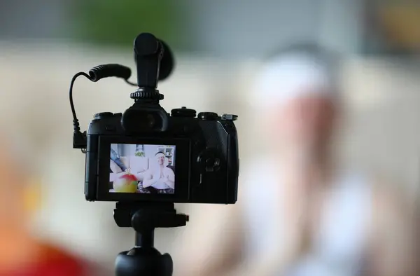 Digital Camera Shooting Professional Yoga Man Vlog. TV Camcorder Record Male Sportsman. Equipment for Video Shot in Vlogger Apartment. Media Technology on Blur Background Closeup Photography