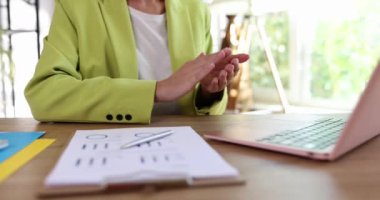 Businesswoman in suit clapping in front of laptop screen at business conference closeup 4k movie slow motion. Business negotiations online concept