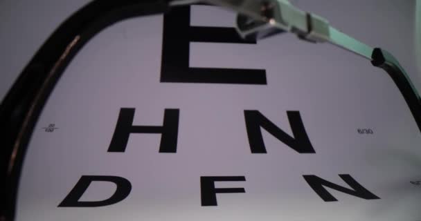 Glasses Background Vision Test Table Closeup Farsightedness Nearsightedness Astigmatism — Stock Video