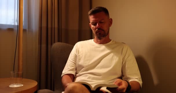 Male Tourist Sitting Hotel Premise Reads Favourite Book Couch Businessman — Stock Video