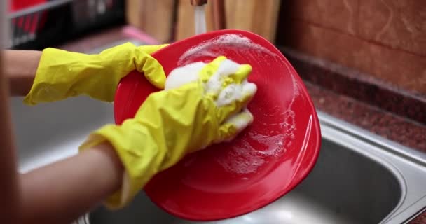 Closeup Hands Yellow Cleaning Rubber Gloves Washing Dishes Kitchen Sink — Stock Video