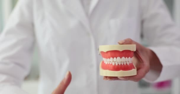 Dentist Holding Prosthesis Showing Thumbs Dental Approval — Stock Video