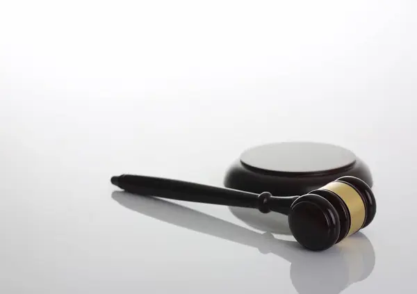 Judge hammer with stand on gray background for making decisions disputes of an arbitration. Court lawfulness actions of lawyers prosecutor and a lawyer bringing to order and responsibility..