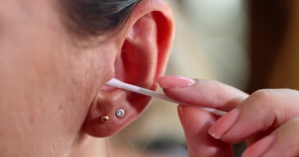 Woman Cleans Her Ear Cotton Swab Close Concept Ear Plug — Stock Video