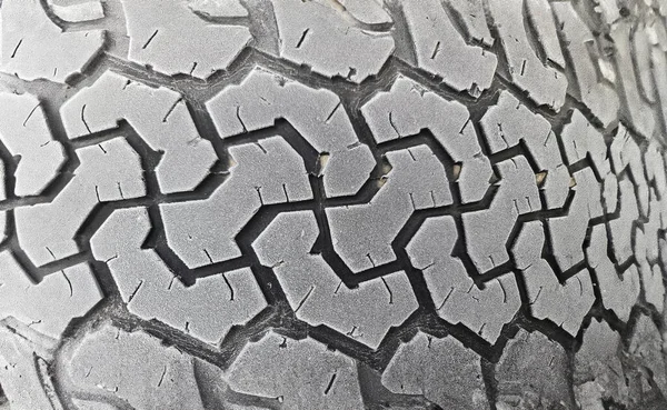 Winter tires on car wheel with frost closeup. Changing winter tires for summer concept