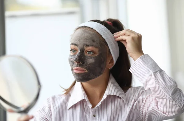 Woman make home spa chocolate mask portrait.