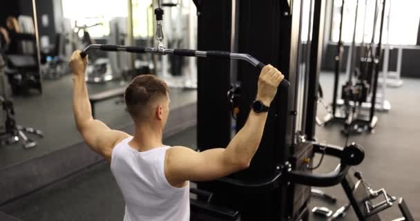 Muscular Man Doing Back Exercises Machine Gym Workouts Sports Healthy — Stock Video