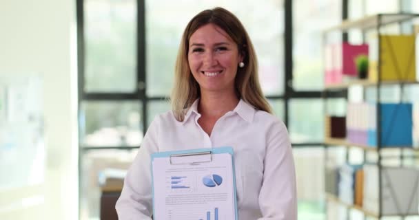 Positive Woman Employee Smile Shows Paper Document Productivity Graphs Pride — Stock Video