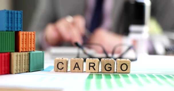 Cargo Inscription Wooden Cubes Table Close Shallow Focus Transport Company — Stock Video
