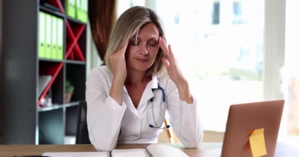 Tired Female Doctor Massages Her Temples Slowmotion Headache Hard Days — Vídeos de Stock
