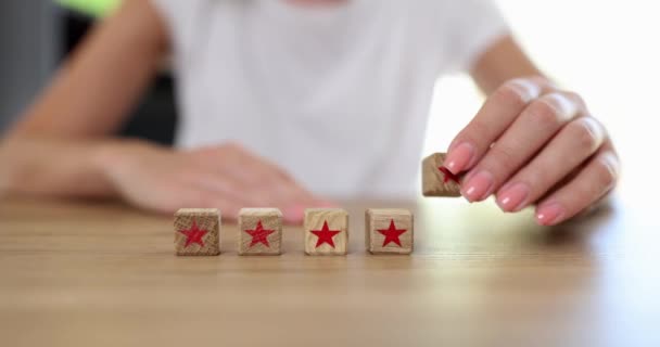 Table Row Wooden Cubes Stars Closeup Shallow Focus Woman Adds — ストック動画