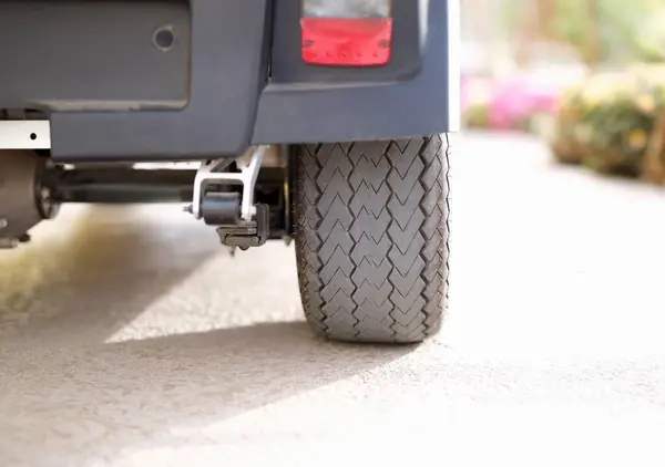 Rubber black car wheel standing on asphalt closeup. Car parking rules concept