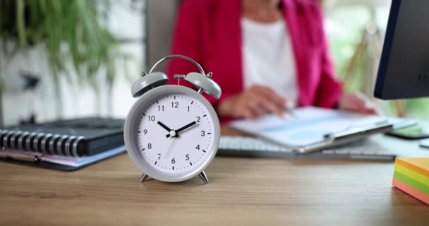 Closeup Alarm Clock Foreground Businesswoman Working Office Background Employee Woman — Stock Video
