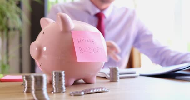 Man Considers Home Budget Financial Savings Piggy Bank Savings Investment — Stockvideo