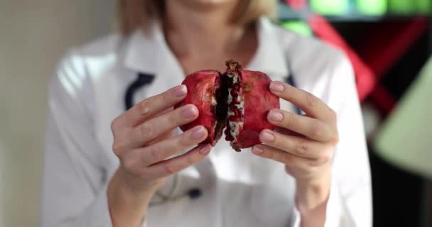 Doctor Nutritionist Breaking Pomegranate Fruit Two Halves Closeup Movie Slow — Vídeo de Stock